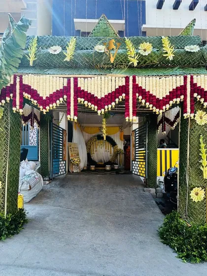 A grand and traditional Chapra entrance, handcrafted with coconut leaves and fresh flowers. This beautiful archway provides a warm, auspicious welcome for guests at any special occasion.