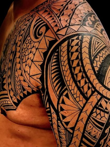 A full sleeve and chest tattoo in a dense Polynesian style. This kind of large-scale work requires many hours of dedication from both the client and me to achieve a perfect result.