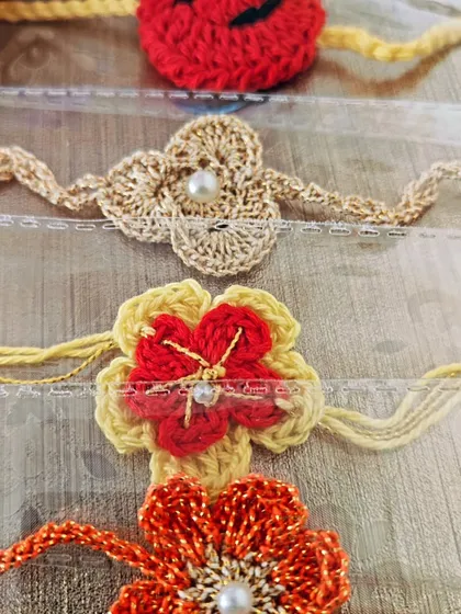 A close-up of some of my floral rakhi designs. I use different stitches and sometimes add a bit of shimmer thread to make them special.
