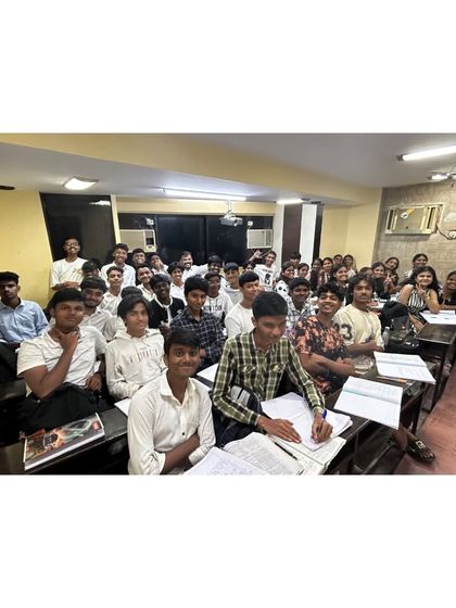 A classroom full of focused students during our Black and White Day celebration. Even during fun events, learning remains a priority as students engage with their coursework.