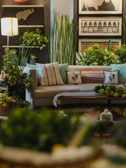 Another view of the lush green lounge area, showing how we transformed an indoor space into a sophisticated, nature-inspired haven.