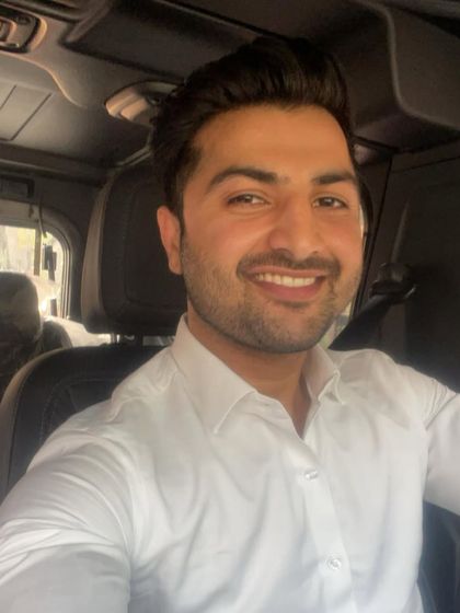 A smile from the car. Staying positive is key in a high-pressure job.