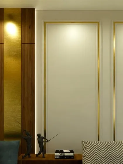 A detail shot of the wall paneling, which combines wood with brass inlay for a touch of subtle, modern luxury.