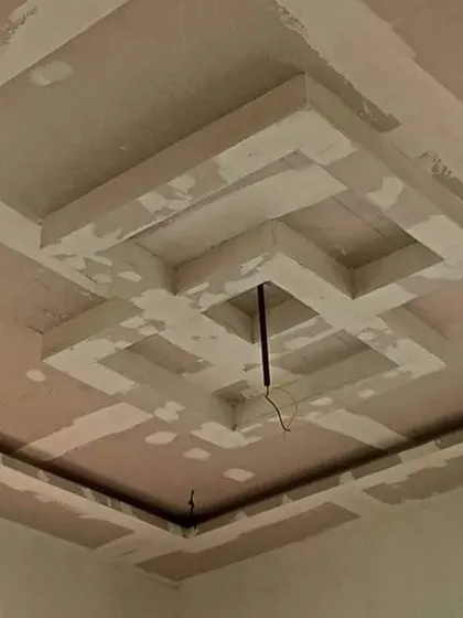 A multi-layered square design taking shape. This kind of work requires precise measurements to ensure all lines are perfectly parallel and clean.