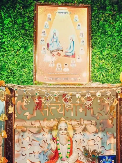 An artificial green wall installed as a serene backdrop for a home temple or prayer area. The lush greenery enhances the peaceful and sacred atmosphere of the space.