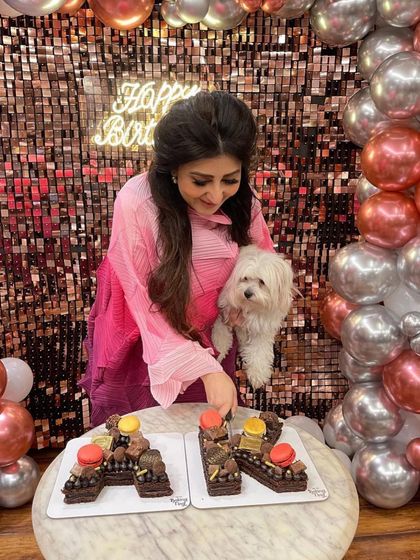 Even the furry family members approve of the birthday cake! A lovely moment from the celebration.