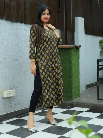 Another look from the Afsana brand catalogue shoot. The checkered floor and simple background ensure the geometric print of the kurta is the main focus.