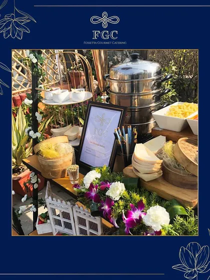 Our live dim sum station, complete with multi-tiered steamers and a variety of fillings and sauces. This setup allows guests to enjoy perfectly steamed, hot dumplings made to order.