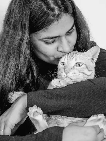 The same loving moment captured in black and white, emphasizing the emotion and texture of the scene. It creates a timeless, classic feel.
