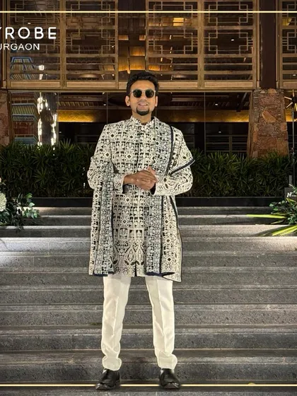 A full view of the bold black and white geometric print sherwani. This is for the man who isn't afraid to make a fashion statement at a wedding event.