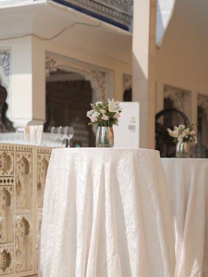 Simplicity at its best. A single, small floral arrangement on a cocktail table is sometimes all you need to add a touch of elegance.