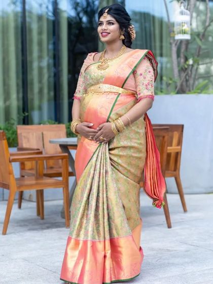 Sukrutha looking absolutely radiant. This full-length shot showcases her beautiful silk saree and the elegant, traditional look we created for her special day.