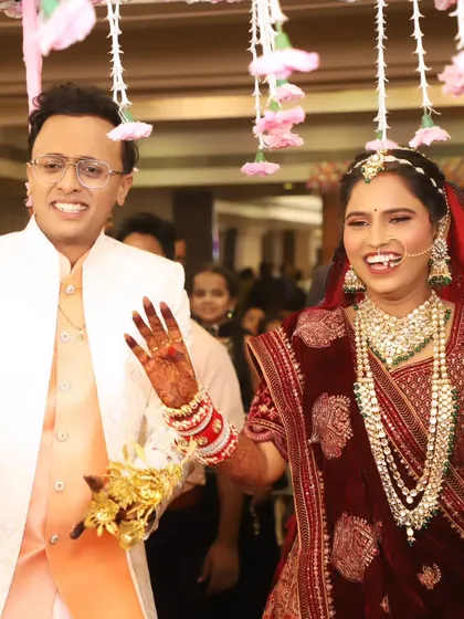 The joy of a bride's grand entrance. Her makeup is designed to be picture-perfect from every angle, capturing her happiness and radiance.
