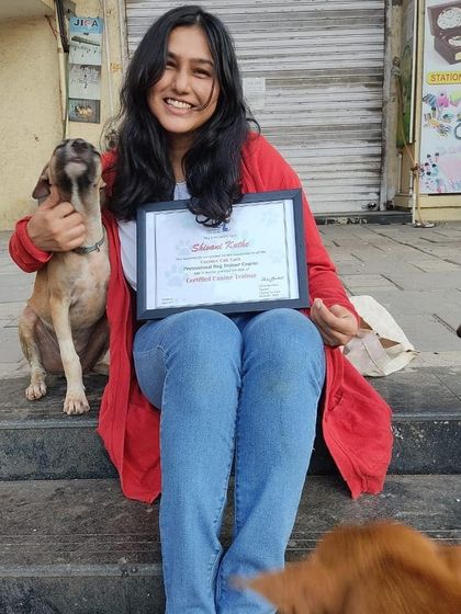 Posing proudly with my certification and a new friend. My work is dedicated to helping more people understand and appreciate these wonderful animals.