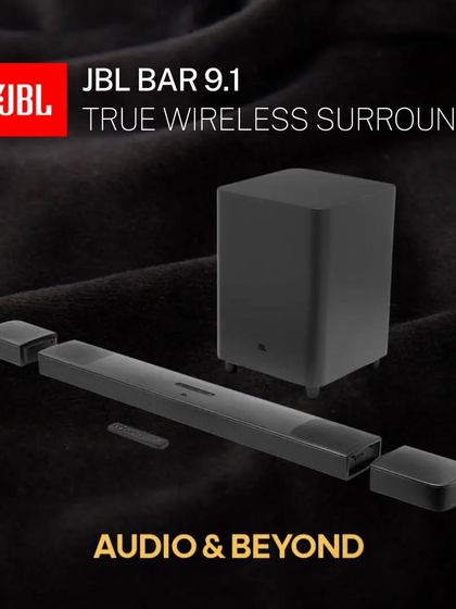 The JBL Bar 9.1 offers true wireless surround sound. This product shot shows the main soundbar with its detachable end-cap speakers and the accompanying wireless subwoofer, a complete package for immersive audio.