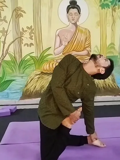 This advanced hip-opening and quad stretch shows the level of flexibility that can be achieved through a dedicated practice. I guide students towards their goals safely.
