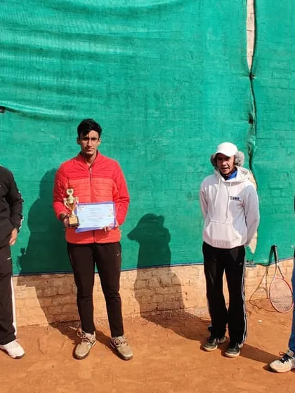 A player receiving his runner-up certificate, reflecting the competitive results from my senior training group.