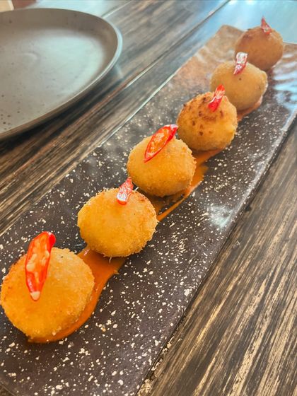 My Jalapeño Cheeseballs are crispy on the outside, and incredibly cheesy on the inside, with a little kick of spice. They are very, very yummy.