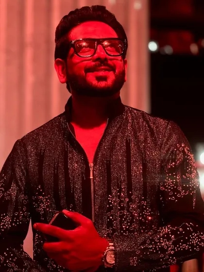 Caught in a moment of reflection during the Diwali event. The warm red lighting created a truly magical atmosphere.
