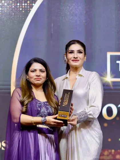We are consistently recognized for our excellence. Here we are accepting the Best Beauty Academy Award for the fifth consecutive time, this time from actress Raveena Tandon. This is a testament to the hard work of our team and the success of our students.