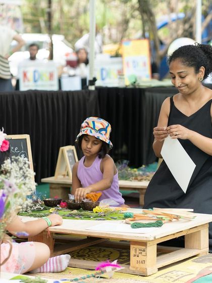 A candid moment from our nature crafts workshop. Using natural materials like leaves and flowers, children get to connect with nature and create something beautiful. It’s a calm, creative corner amidst the buzz of the market.
