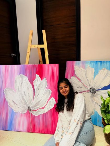 Sitting with two completed canvases from my "The Becoming" series. The different color stories, one with pinks and the other with blues, show the varied emotions involved in the journey of growth.