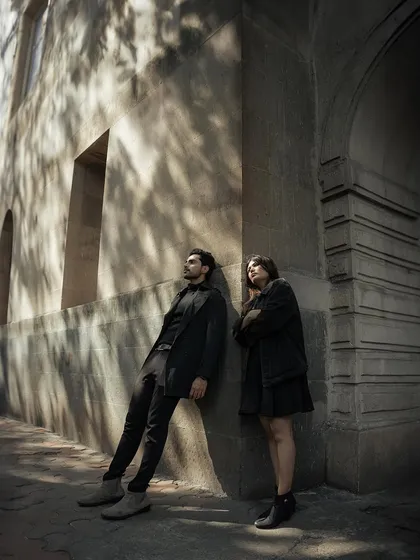 Leaning against a wall, bathed in the dappled sunlight filtering through the trees. This is a moment of quiet contemplation, a peaceful pause in their city adventure.