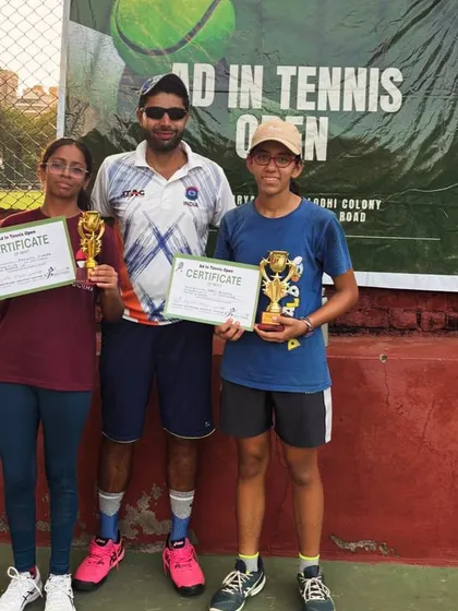 Two of our dedicated players with their trophies and certificates after a hard fought tournament. Their progress is a testament to their commitment.