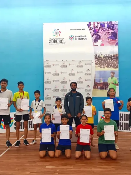 A coach with the winners from the summer camp tournament. Our on-ground team is dedicated to nurturing young talent.