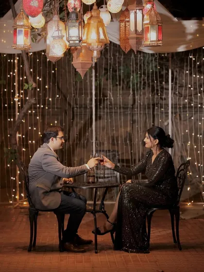 A romantic dinner scene. The makeup is glamorous and sophisticated, perfect for an elegant evening setting.