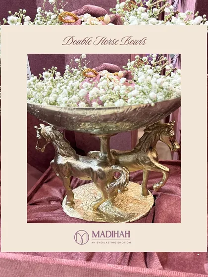 A product shot of our Double Horse Bowls, a masterpiece of grandeur. The two powerful, sculpted horses create a dynamic and graceful base for the serving bowl, making it a perfect centerpiece.