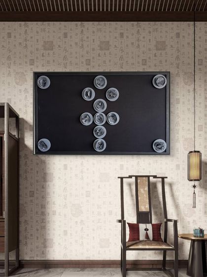 The Ankh artwork in a room with traditional wallpaper, bridging history with minimal elegance.