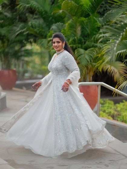 Another dynamic shot of the bride twirling in her Sangeet lehenga. The movement shows just how light and comfortable the outfit is, proving you don't have to sacrifice style for comfort.