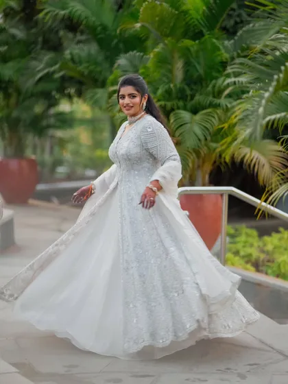 Another dynamic shot of the bride twirling in her Sangeet lehenga. The movement shows just how light and comfortable the outfit is, proving you don't have to sacrifice style for comfort.