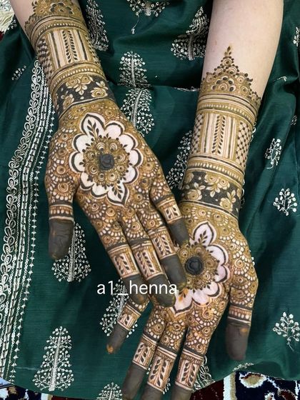 A beautiful design featuring a large flower on the back of the hand, filled with negative space to make it pop.