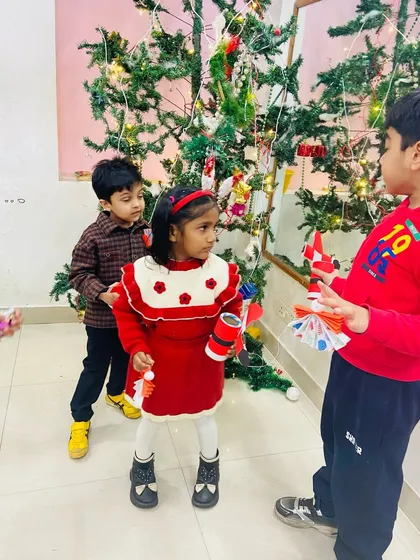 Kids interacting and sharing their Christmas crafts, making new friends during the festive season.