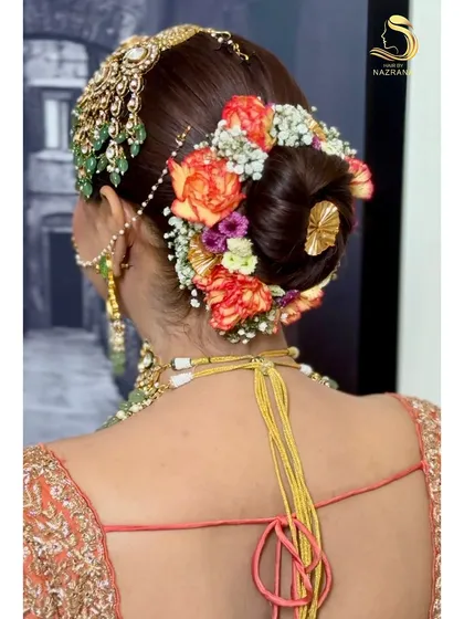 Another angle of the intricate floral bun, showing how the flowers and passa work together for a complete look.