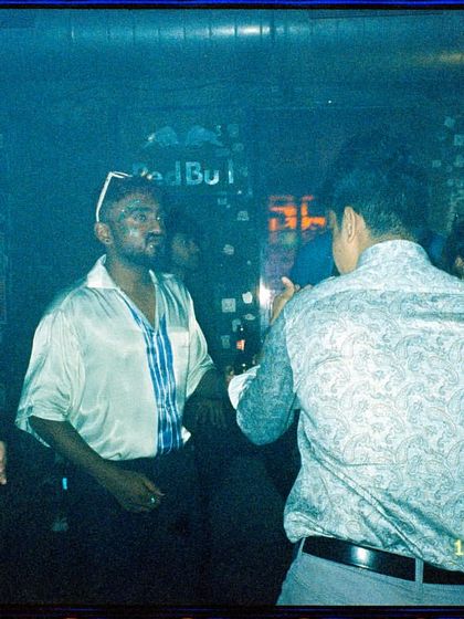 A candid moment on film of guests enjoying the party. It shows the real, unposed fun that happens at my events.