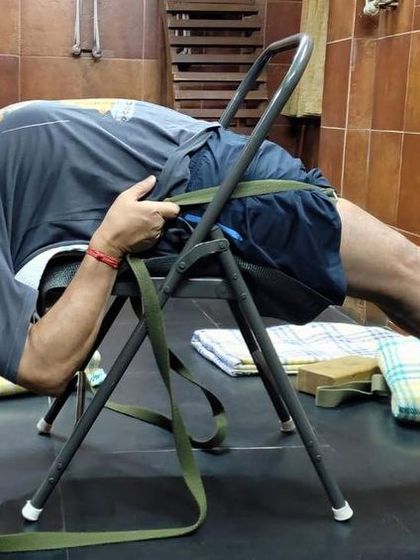 A supported backbend against the wall, demonstrated for an online class. This helps to open the chest and is a great preparation for deeper backbends.