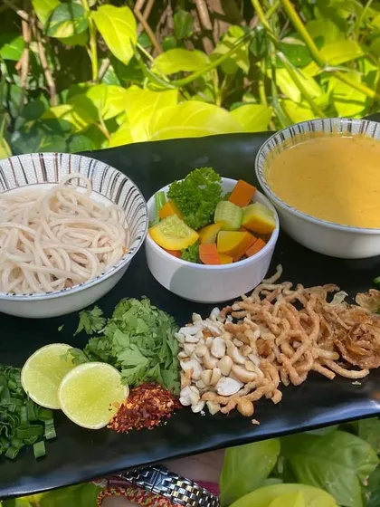 Presenting our Burmese Khow Suey. We provide all the traditional accompaniments so you can customize your bowl just the way you like it.