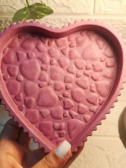 Our heart-shaped trinket tray with a textured bottom, shown here in a lovely solid purple.