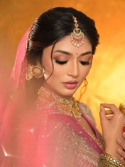 A dreamy, artistic shot of the bride, with a soft focus effect highlighting her delicate features and jewellery.