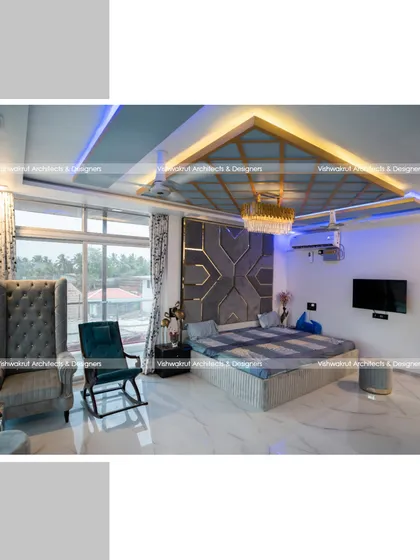 The master bedroom interior, designed for ultimate comfort and style. The combination of a high-back wing chair, a modern rocking chair, and strategic mood lighting creates a sophisticated yet relaxing atmosphere.