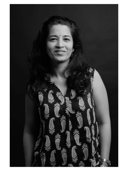 A slightly different angle from the same portrait session, maintaining the classic and engaging feel of the black and white series.