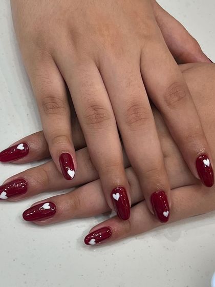 A full view of our popular red and white heart nail art, perfect for Valentine's Day or any day you're feeling the love.