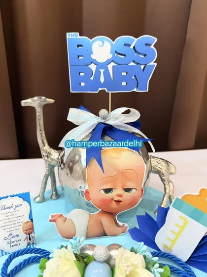 A close-up of the Boss Baby hamper, showing the character cutouts and themed decorations.