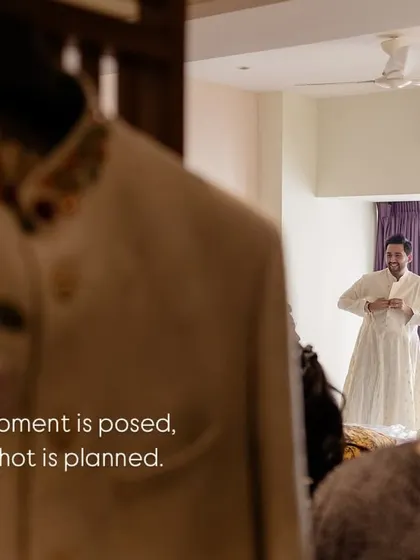 Not every moment is posed, not every shot is planned. We love capturing the groom getting ready through a doorway, a candid glimpse into the real, unstaged moments of the day.