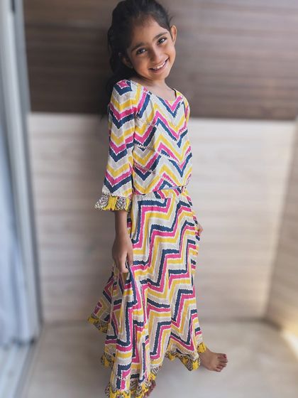 A burst of color and playful chevron prints! This vibrant dress is made from the softest cotton, perfect for twirling all day long.