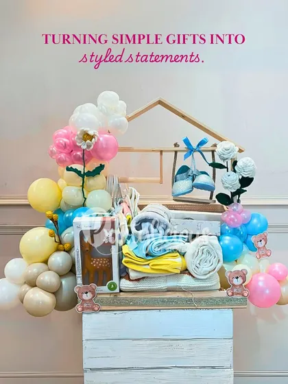Turning simple gifts into styled statements. This beautifully arranged baby shower gift hamper is a gift in itself.