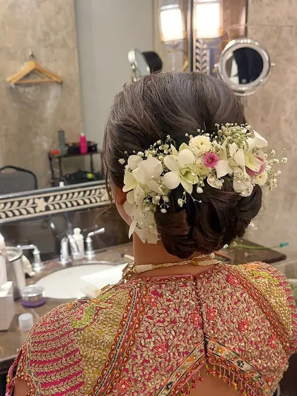 This shot from the dressing room captures the final touches on this beautiful floral updo.